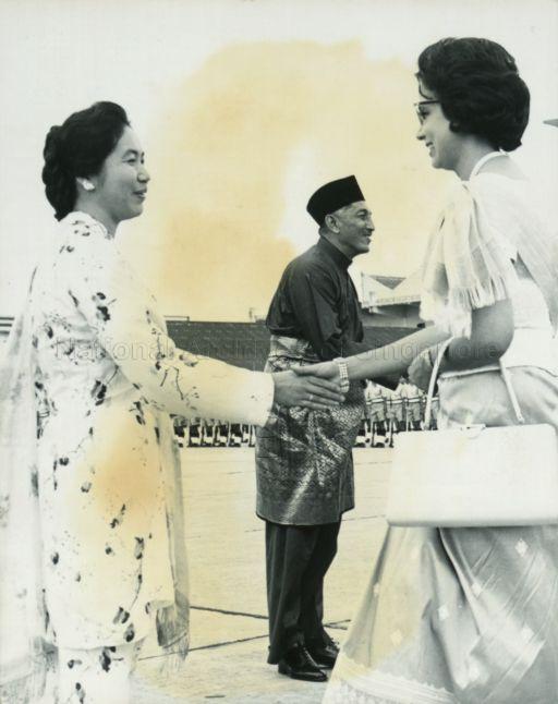 Madame Sihanouk, wife of Prince of Cambodia, bidding a final farewell to Puan Noor Aishah at the end of her state visit to Singapore
