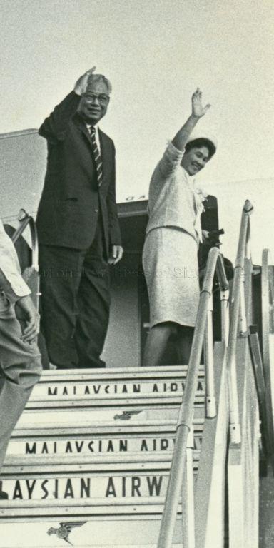 Governor-General of Trinidad and Tobago, Sir Solomon Hochoy, and Lady Hochoy waving farewell at the end of their visit