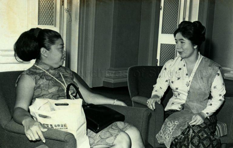 Puan Noor Aishah with Red Cross Society member Mrs Chan Kwok Kwan on occasion of the handing over of collection from the Society at Istana
