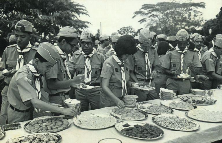 Scouts having refreshments at presentation of State Colours by President Yusof Ishak to the Singapore contingent attending the Penang Jamboree, at the Istana