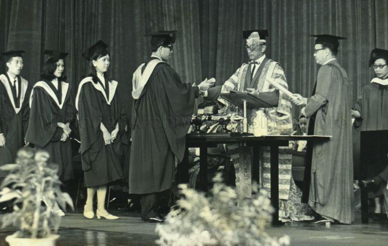 President Yusof Ishak, as Chancellor of University of Singapore, presenting graduands with their degree at convocation at National Theatre
