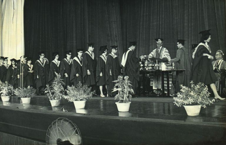 President Yusof Ishak, as Chancellor of University of Singapore, presenting graduands with their degree at convocation at National Theatre