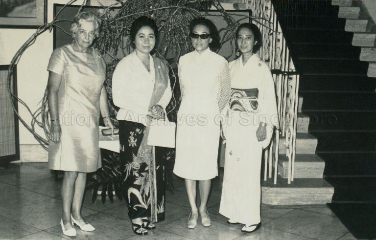 Puan Noor Aishah posing with Mrs Yoshida, wife of the Japanese Ambassador, and guests at flower arrangement demonstration by Meikoi Kasuya, master of the Ichiyo School of Floral Art in Japan, held in Mrs Yoshida's house at 5 Tyersall Road