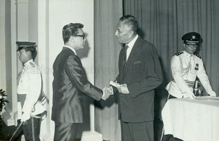 President Yusof Ishak presenting the President's scholarship to Jeffrey Chan Wah Teck at the Istana