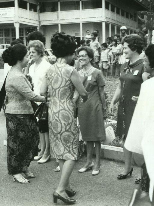 Puan Noor Aishah meeting officials of the Young Women's Christian Association (YWCA) on her arrival for opening of the new YWCA hostel at Fort Canning