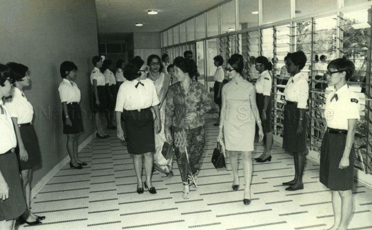 Puan Noor Aishah talking to Chief Commissioner of the Singapore Girl Guides Association Madam Chan Siok Fong as she arrives for the Association's celebrations of Diamond Jubilee Year of World Guiding at Singapore Conference Hall
