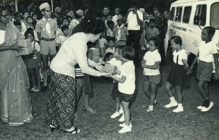 Puan Noor Aishah giving away prizes at the Singapore Association for Retarded Children's Sports Day at Lee Kong Chian Centre
