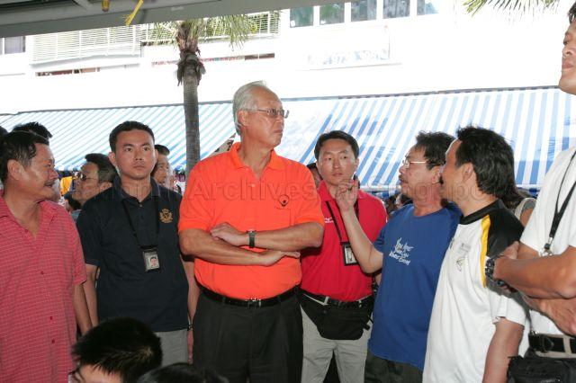 Senior Minister Goh Chok Tong touring the hawker centre during his walkabout in Marine Terrace after distribution of hongbao and gifts to needy residents in Marine Parade held at communal hall in Block 17A
