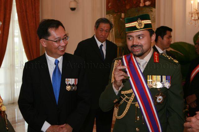 Crown Prince of Brunei Darussalam General Haji Al-Muhtadee Billah (right) with Singapore's Ambassador to Brunei Darussalam Joseph Koh Kok Hong during investiture ceremony where the Crown Prince is conferred Distinguished Service Order (Military) by President S R Nathan at Istana