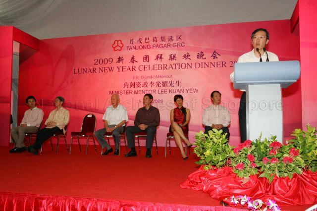 Member of Parliament (MP) for Tanjong Pagar Group Representation Constituency (GRC) Sam Tan Chin Siong speaking at the GRC Lunar New Year celebration dinner held at Henderson Secondary School, 100 Henderson Road. Seated on stage are Minister Mentor Lee Kuan Yew, four other MPs for Tanjong Pagar GRC and grassroots leader.