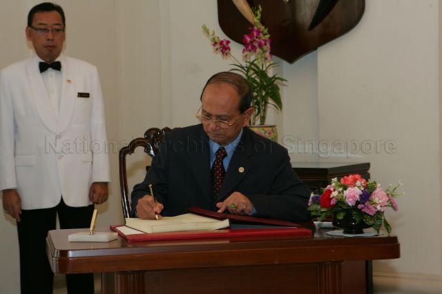 Prime Minister of Myanmar General Thein Sein signing guest book at Istana during his courtesy call on Acting President J Y Pillay