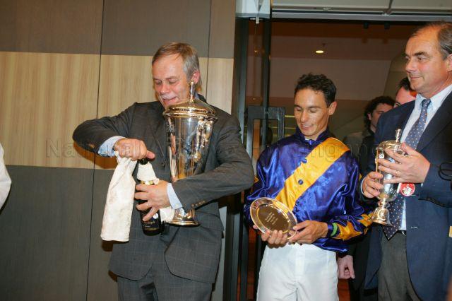 Jockey Tiago Josue Pereira (centre) with his trophy after winning Singapore Airlines International Cup race at Singapore Turf Club