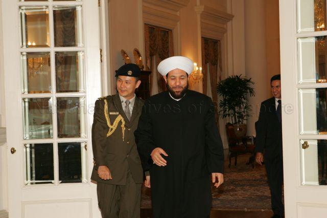 The Grand Mufti of Syria, Sheikh Dr Ahmad Badreddin Hassoun (right) with an aide-de-camp after his call on President S R Nathan at Istana