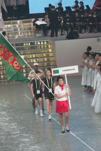 Team from Turkmenistan marching into arena during opening ceremony of Asian Youth Games at Singapore Indoor Stadium
