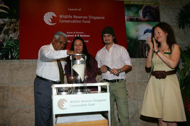 President S R Nathan filling a time capsule with wishes for Singapore's wildlife made by the public, which is scheduled to be opened on 50th anniversary of Singapore Zoo in 2023, during launch of Wildlife Reserves Singapore Conservation Fund (WRSCF), an independent conservation fund dedicated primarily to native wildlife conservation and education, at the zoo in Mandai. With him are (from right) Group Chief Executive Officer of Wildlife Reserves Singapore (WRS) Ms Fanny Lai, MediaCorp artiste Gurmit Singh and Chairperson of WRS and WRSCF Ms Claire Chiang.