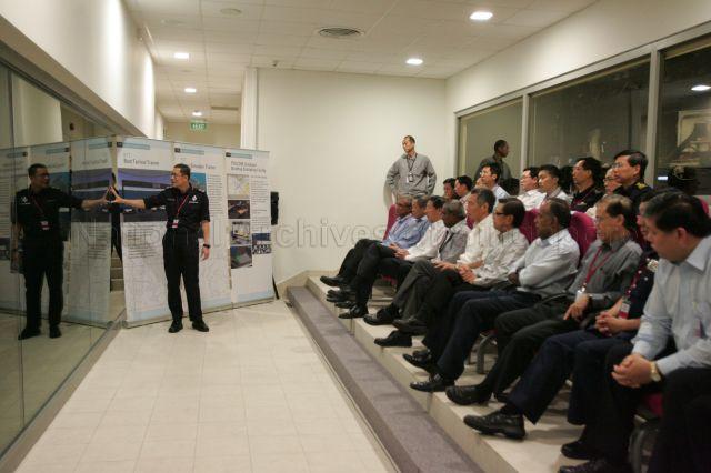 Prime Minister Lee Hsien Loong with ministers and guests being briefed on anti-terror drill Exercise Northstar Vll at Rasa Sentosa Resort prior to the counter-terrorism exercise