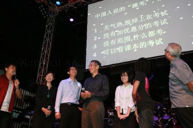 Prime Minister Lee Hsien Loong with his three assistants Ms Rachel Peh (back to camera), Ms Mandaraz Lim Shi Hui and Mr Ang Kok Yong participating in quiz on Chinese language and modern China to mark launch of CLing, a new Chinese-learning media platform (cling.omy.sg) jointly presented by Business China and omy.sg (Singapore Press Holdings' bilingual news portal), at Dragonfly, St James Power Station in Sentosa Gateway