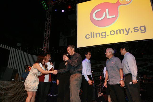 Prime Minister Lee Hsien Loong shaking hands with masters of ceremonies during launch of CLing, a new Chinese-learning media platform (cling.omy.sg) jointly presented by Business China and omy.sg (Singapore Press Holdings' bilingual news portal), at Dragonfly, St James Power Station in Sentosa Gateway