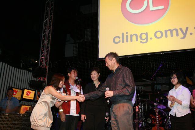 Prime Minister Lee Hsien Loong shaking hands with masters of ceremonies during launch of CLing, a new Chinese-learning media platform (cling.omy.sg) jointly presented by Business China and omy.sg (Singapore Press Holdings' bilingual news portal), at Dragonfly, St James Power Station in Sentosa Gateway