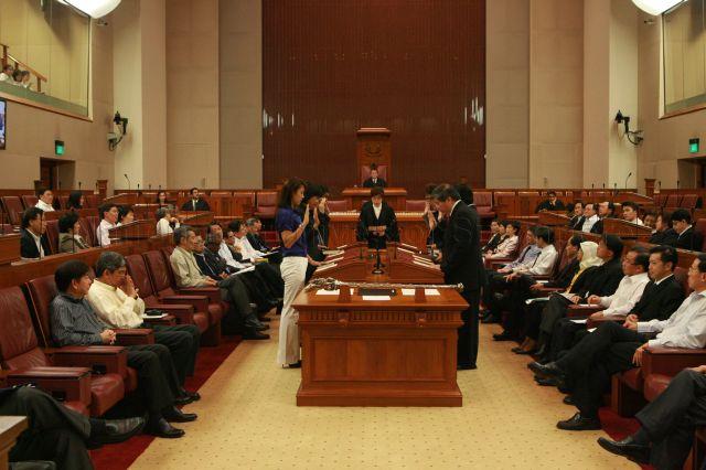 Nine Nominated Members of Parliament (NMPs) taking their oath of allegiance at Parliament House before Parliament sitting begins