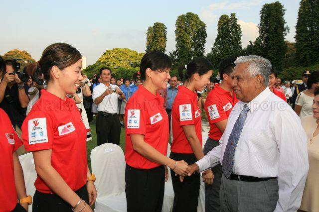 President S R Nathan greeting Ms Joanne Soo of Singapore Women's Everest team during reception held in honour of women Everest climbers at Istana Lawn. On the left is Ms Lee Li Hui, one of the team members.