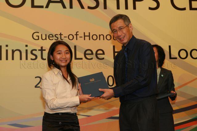 Prime Minister Lee Hsien Loong presenting new China scholarship of Public Service Commission (PSC) to Miss Tan Bao Jia at a ceremony held at Shangri-La Hotel in Orange Grove Road
