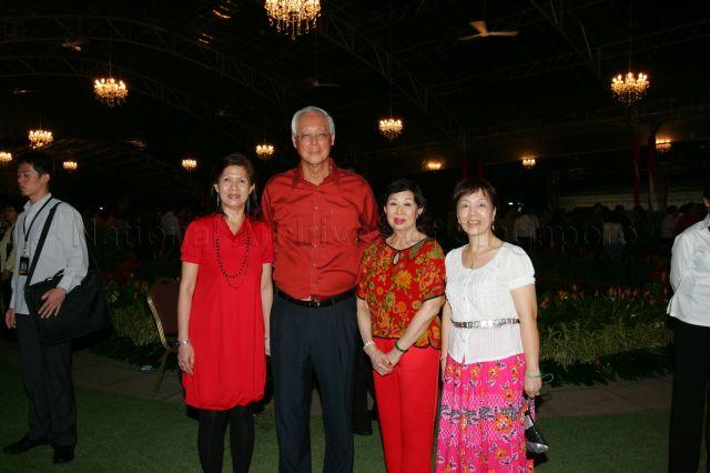 Senior Minister and Mrs Goh Chok Tong posing for photographs with guests during National Day reception hosted by President S R Nathan at Istana Lawn