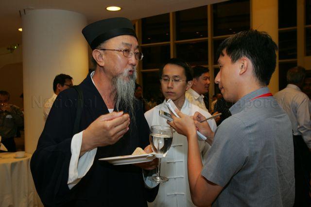 Taoist religious leader Reverend Master Lee Zhiwang speaking to reporter at the reception during National day Rally at University Cultural Centre, National University of Singapore in Kent Ridge