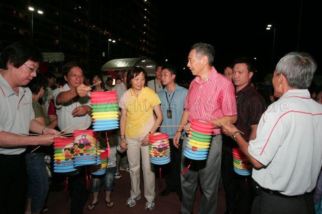 Prime Minister Lee Hsien Loong, accompanied by Member of Parliament for Ang Mo Kio Group Representation Constituency (GRC) Lee Bee Wah, participating in the lantern parade during Nee Soon South lantern night at Block 838, Yishun Street 81