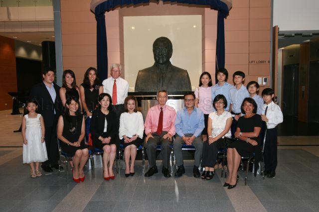 Prime Minister Lee Hsien Loong and descendants of Khoo Teck Puat, including his children Elizabeth Khoo (seated, second from left), Mavis Khoo (seated, third from left) and film director Eric Khoo (seated, third from right), posing for photographs in front of the late tycoon's bust during the official opening of Duke-National University of Singapore (NUS) Graduate Medical School and its new campus, the Khoo Teck Puat Building, at 8 College Road. The medical school is supported by an $80 million donation from the Estate of Khoo Teck Puat, which was matched dollar-for-dollar by a contribution from the Singapore government.