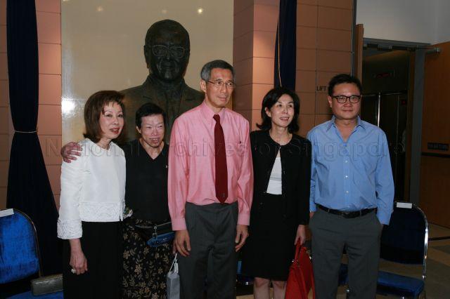 Prime Minister Lee Hsien Loong and Dr Lee Wei Ling (second from left) with children of late tycoon Khoo Teck Puat, (from right) film director Eric Khoo, Elizabeth Khoo, and Mavis Khoo (left), in front of the late tycoon's bust during the official opening of Duke-National University of Singapore (NUS) Graduate Medical School and its new campus at 8 College Road. The medical school is supported by an $80 million donation from the Estate of Khoo Teck Puat, which was matched dollar-for-dollar by a contribution from the Singapore government.
