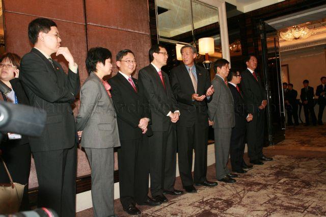 Ministers (from left) Rear Admiral [NS] Lui Tuck Yew, Mrs Lim Hwee Hua, Gan Kim Yong, Raymond Lim Siang Keat, Dr Ng Eng Hen, Khaw Boon Wan, Mah Bow Tan and Deputy Prime Minister Teo Chee Hean at St Regis Hotel in Tanglin Road to call on Chinese President Hu Jintao, who is on a three-day state visit to Singapore