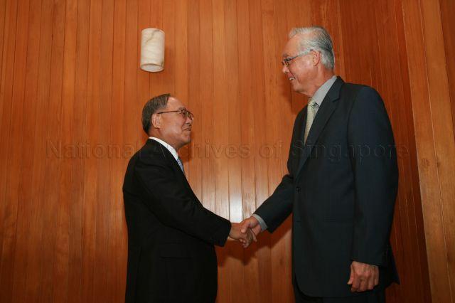 Chairman of Nippon Keidanren, the Japan Federation of Economic Organisation, Fujio Mitarai greeting Senior Minister Goh Chok Tong during a courtesy call at Istana