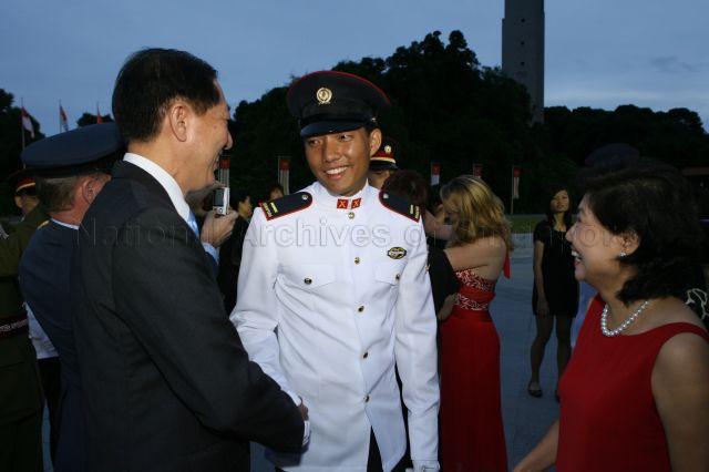 Deputy Prime Minister and Defence Minister Teo Chee Hean and wife Poh Yim congratulating their son, Second Lieutenant Teo Eng Siang, during the commissioning parade held at SAFTI Military Institute