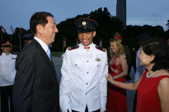 Deputy Prime Minister and Defence Minister Teo Chee Hean and wife Poh Yim congratulating their son, Second Lieutenant Teo Eng Siang, during the commissioning parade held at SAFTI Military Institute