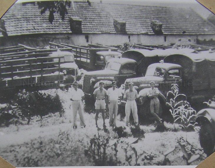 One of the tasks of the Nanyang Chinese volunteer drivers and mechanics was to take delivery of vehicles. Zhuang Linzu (second from right) and Lin Xinquan (second from left) were receiving US Dodge vehicles at Haiphong, Vietnam