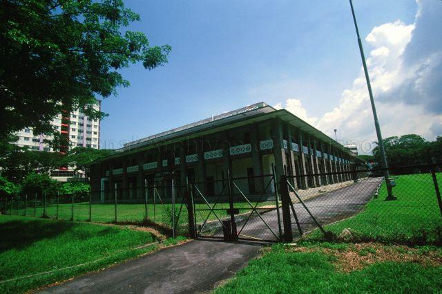 The old Victoria School as seen from King George's Avenue. The school building has been re-developed with the original structure retained and is now the office of the People's Association.