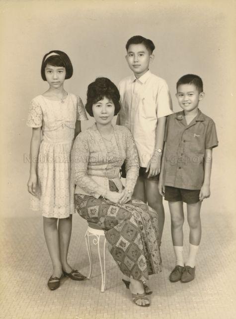 A family photograph of Madam Tan Siam Kheng with her daughter and two sons