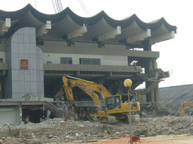 Demolition of the National Stadium in progress. Photo shows a few cranes in the process of tearing down the grandstand. The National Stadium was officially closed on 30 June 2007 but the demolition process was only started on 29 September 2010 to make way for the new Singapore Sports Hub.