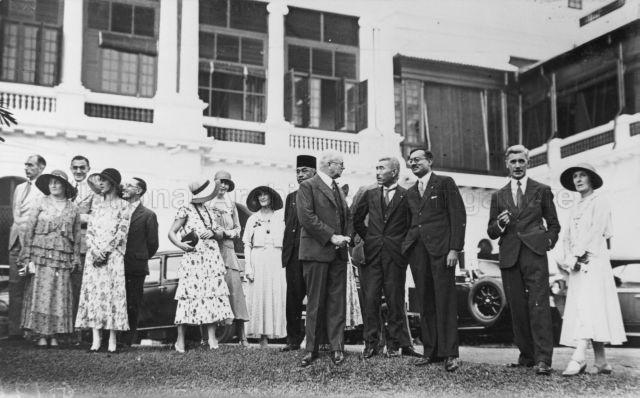 Uo, leader of the Japanese Association (fourth from right), attends party given by British.