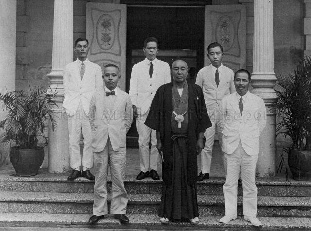 Chubei Takahashi, manager of Echigoya Draper, with his Japanese staff
