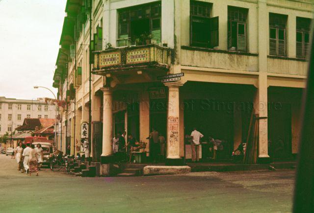 Junction of Mohamed Sultan Road with River Valley Road. In the background on the left is the building of the Singapore head office of United Engineers Limited