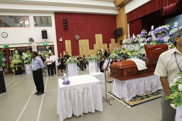 Taken at: Funeral wake for Senior Minister of State for Foreign Affairs Dr Balaji Sadasivan at Cheng San Community Club Pictured: Wife, daughter and son of the late Dr Balaji Sadasivan, Dr Ma Swan Hoo, Anita Sadasivan and Dharma Sadasivan