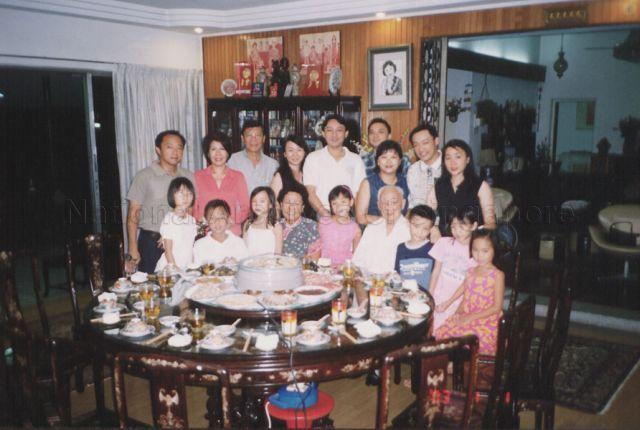 Mr and Mrs Wong Kwok Leong (both seated) in a group photograph with family during New Year dinner