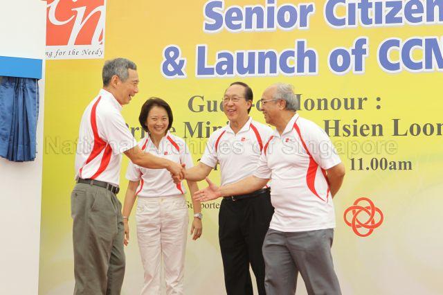 Prime Minister Lee Hsien Loong shaking hands with Mr Ernest Wong, former group chief executive officer of MediaCorp, and former Member of Parliament (MP) Dr S Vasoo after unveiling commemorative plaque during opening of Community Care Network (CCN) community fair for senior citizens and launch of CCN Senior Activity Centre (CCNSAC) at Block 420, Ang Mo Kio Avenue 10. Looking on is MP for Ang Mo Kio Group Representation Constituency (GRC) Lee Bee Wah.