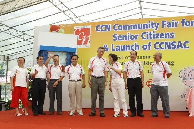 Prime Minister Lee Hsien Loong, Members of Parliament for Ang Mo Kio Group Representation Constituency (GRC) Lee Bee Wah (third from right) and for Yio Chu Kang Seng Han Thong (fourth from left) with grassroots leaders at opening of Community Care Network (CCN) community fair for senior citizens and launch of CCN Senior Activity Centre (CCNSAC) held at Block 420, Ang Mo Kio Avenue 10