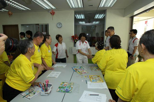 Prime Minister Lee Hsien Loong and Member of Parliament for Ang Mo Kio Group Representation Constituency (GRC) Lee Bee Wah (centre) visiting Community Care Network Senior Activity Centre (CCNSAC) at Block 420, Ang Mo Kio Avenue 10, during opening of CCN community fair for senior citizens and launch of the activity centre