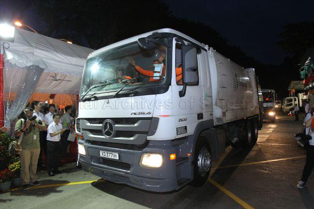 Trucks leaving SembWaste Bukit Merah depot to make the morning garbage collection run. Prime Minister Lee Hsien Loong visited workers, who perform essential duties, at the depot on the first day of Chinese New Year.