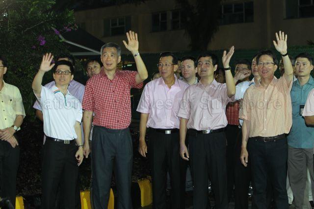 (From left) Senior Vice President of SembWaste Lim Chin Khuang, Prime Minister (PM) Lee Hsien Loong, Sembcorp Group President and Chief Executive Officer Tang Kin Fei, Minister of State (Prime Minister's Office) and Deputy Secretary-General of National Trades Union Congress (NTUC) Heng Chee How and Minister (Prime Minister's Office) and NTUC Secretary-General Lim Swee Say at SembWaste Bukit Merah depot. PM Lee visited workers who perform essential duties at the depot on the first day of Chinese New Year.