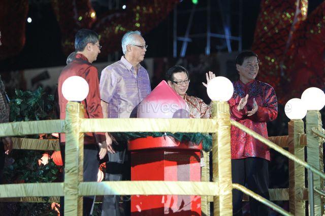 (From left) Minister (Prime Minister's Office) Lim Boon Heng, Senior Minister Goh Chok Tong, Minister for National Development Mah Bow Tan and Chief Executive Director of People's Association Yam Ah Mee on a festive float during second night of Chingay parade 2011 at F1 Pit Building, Marina Bay